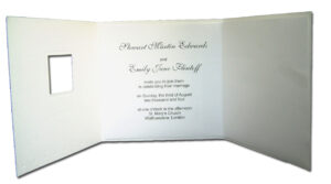 white folded wedding invitation