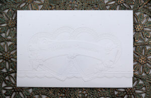 Only 50p each. Simple white embossed hearts cheap budget invitation 5076-7735