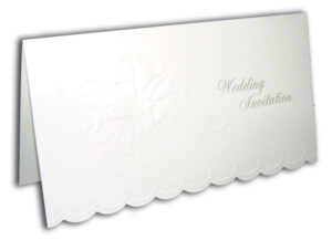 plain white folded wedding invitation with summer flower