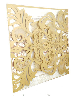 gold card with wedding invitation inserts
