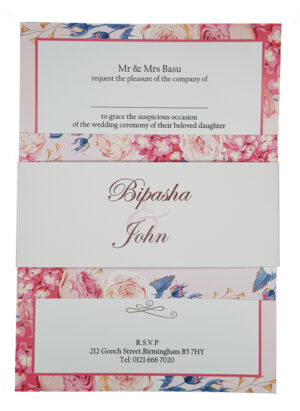 blush pink floral wedding invitations with band with flowering blue plants