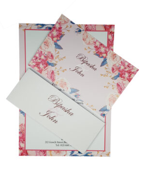 floral wedding invitation with vibrant pink seasonal garden flowers