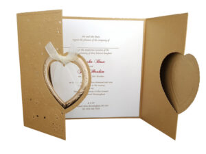 gatefold invitation in gold with bow and hearts