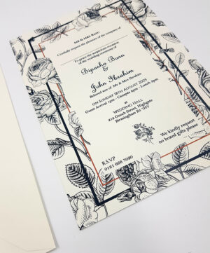 white wedding invitation with black illustrated roses and wildlife