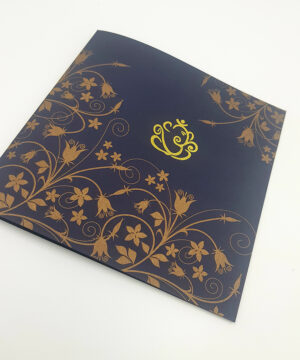 hindu invitation card for wedding with Ganesh design in gold on blue card