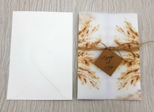 Brown print vellum sleeves invitation