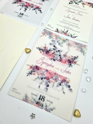 custom vellum printing with flowers and gold pin