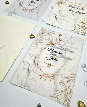 vellum layered wedding invitation in rustic gold