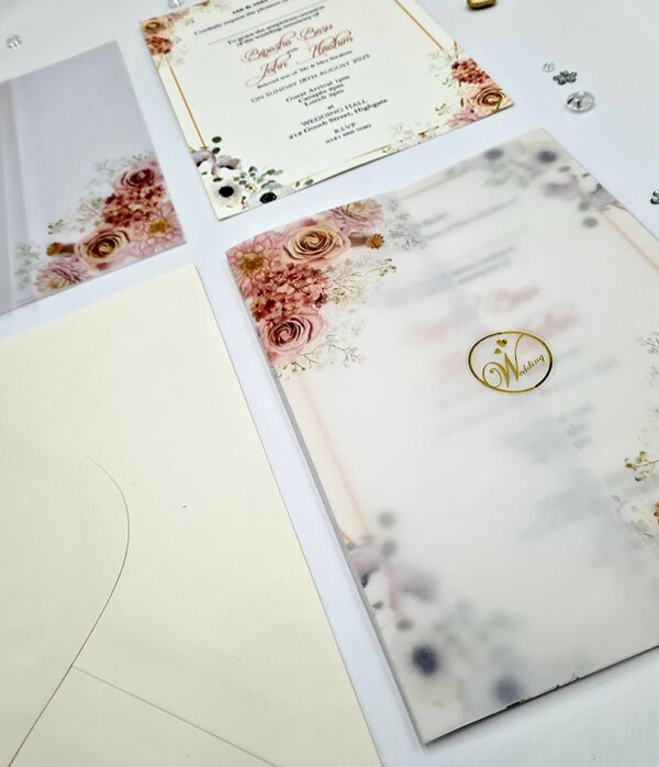 Peachy coloured vellum overlay wedding invitations